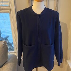 FIGS Bellery scrub jacket in navy blue from the technical collection  larger